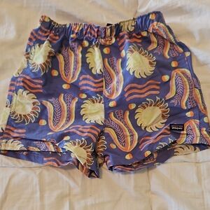 Patagonia Purple Shorts with Yellow and Orange Design